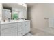 Modern bathroom features double sink vanity with tile floors, and neutral paint at 3481 Lakeview Crk, Lithonia, GA 30038