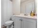 A cozy bathroom with a white vanity and toilet under a white shower curtain at 3481 Lakeview Crk, Lithonia, GA 30038