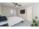 Bright bedroom features a TV, carpet, natural light and a view into the bathroom at 3481 Lakeview Crk, Lithonia, GA 30038