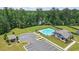 Community pool and clubhouse surrounded by lush landscaping, perfect for recreation at 3481 Lakeview Crk, Lithonia, GA 30038