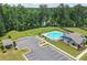 Aerial view of community pool with a picnic area, parking, and restroom at 3481 Lakeview Crk, Lithonia, GA 30038