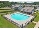 An aerial view of the outdoor community pool surrounded by lounge chairs and seating areas at 3481 Lakeview Crk, Lithonia, GA 30038