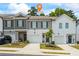 Inviting townhome exterior with single-car garage and well-manicured landscaping at 3481 Lakeview Crk, Lithonia, GA 30038