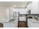 Modern kitchen with granite countertops, stainless appliances, and white cabinets at 3481 Lakeview Crk, Lithonia, GA 30038