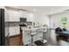 Modern kitchen featuring stainless steel appliances, an island with granite countertops, and bar seating at 3481 Lakeview Crk, Lithonia, GA 30038