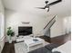 Cozy living room featuring a ceiling fan, plush sofa, and minimalist decor at 3481 Lakeview Crk, Lithonia, GA 30038