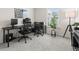 The office has a large desk, ergonomic chairs, and is bathed in natural light from a window for productivity at 3481 Lakeview Crk, Lithonia, GA 30038