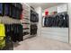 Spacious walk-in closet with ample storage, multiple racks, and built-in shelving for organization at 3481 Lakeview Crk, Lithonia, GA 30038