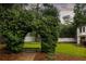 Lush landscaping, mature trees, and a bench are framed by greenery at 3916 E Brookhaven Ne Dr, Brookhaven, GA 30319
