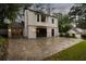 Brick patio, lush green grass, and a two-story home exterior with white brick at 3916 E Brookhaven Ne Dr, Brookhaven, GA 30319