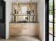 Elegant bar area with custom cabinets, marble countertop, and mirrored backdrop at 3916 E Brookhaven Ne Dr, Brookhaven, GA 30319