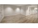 Spacious finished basement with light wood flooring, neutral walls, white trim, and ample lighting at 3916 E Brookhaven Ne Dr, Brookhaven, GA 30319