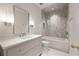 Stylish bathroom with a modern vanity, a tub-shower combo, and geometric-patterned flooring, lit by contemporary lighting at 3916 E Brookhaven Ne Dr, Brookhaven, GA 30319