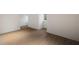 Bright bedroom featuring hardwood floors and white trim, offering a clean and modern aesthetic at 3916 E Brookhaven Ne Dr, Brookhaven, GA 30319