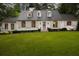 Charming home featuring shuttered windows, dormers, and a well-manicured front lawn at 3916 E Brookhaven Ne Dr, Brookhaven, GA 30319