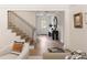 Inviting foyer with staircase, herringbone wood floors, and elegant decor at 3916 E Brookhaven Ne Dr, Brookhaven, GA 30319