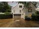 Large garage doors on this home's exterior at 3916 E Brookhaven Ne Dr, Brookhaven, GA 30319