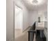 Hallway with decorative light fixture and a black metal banister at 3916 E Brookhaven Ne Dr, Brookhaven, GA 30319