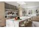 Open kitchen boasts marble island, brass fixtures, open shelving, and professional appliances at 3916 E Brookhaven Ne Dr, Brookhaven, GA 30319