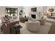 Bright living room with a marble fireplace and stylish neutral-toned furniture at 3916 E Brookhaven Ne Dr, Brookhaven, GA 30319