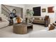 Cozy living room with a large round coffee table and comfortable seating arrangement at 3916 E Brookhaven Ne Dr, Brookhaven, GA 30319