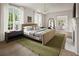 Serene main bedroom features large windows, hardwood floors, and neutral color palette at 3916 E Brookhaven Ne Dr, Brookhaven, GA 30319