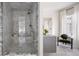 Glass shower boasts marble tile, a rainfall shower head, and a built-in bench at 3916 E Brookhaven Ne Dr, Brookhaven, GA 30319