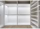 Walk-in closet with wood floor, shelving, and lighted rods at 3916 E Brookhaven Ne Dr, Brookhaven, GA 30319