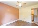 Bedroom featuring a ceiling fan, window, and patterned flooring at 911 White Stag Ln, Canton, GA 30115