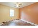 Bedroom with a ceiling fan, window, and patterned flooring at 911 White Stag Ln, Canton, GA 30115