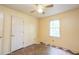Bedroom with a ceiling fan, window, and patterned flooring at 911 White Stag Ln, Canton, GA 30115