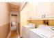 Laundry room with washer and dryer hookups and access to a hallway at 911 White Stag Ln, Canton, GA 30115