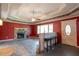 A spacious living room boasts a stone fireplace, ceiling fan, and tray ceiling at 911 White Stag Ln, Canton, GA 30115