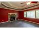 A spacious living room boasts a stone fireplace, ceiling fan, and natural light at 911 White Stag Ln, Canton, GA 30115