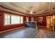 A spacious living room boasts a serving bar, ceiling fan, and multiple doorways at 911 White Stag Ln, Canton, GA 30115