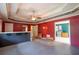 A spacious living room boasts a serving bar, ceiling fan, and open floor plan at 911 White Stag Ln, Canton, GA 30115