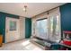 Bright sunroom featuring a garden window, access to the outdoors, and natural light at 911 White Stag Ln, Canton, GA 30115
