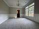 Dining Room with plush carpet flooring, wainscotting and a large window at 1415 Stoney Field Pl, Lawrenceville, GA 30043