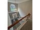 Bright foyer with high ceilings, large arched window, and modern light fixture overlooking the front door at 1415 Stoney Field Pl, Lawrenceville, GA 30043