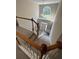 Bright foyer with high ceilings, large arched window, and modern light fixture overlooking the front door at 1415 Stoney Field Pl, Lawrenceville, GA 30043