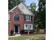A charming two-story brick home with a well-maintained front lawn and landscape at 1415 Stoney Field Pl, Lawrenceville, GA 30043