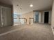 Second floor landing features neutral walls, carpeting, and natural light from a window at 1415 Stoney Field Pl, Lawrenceville, GA 30043