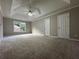 Spacious main bedroom features neutral carpeting, a ceiling fan, and recessed lighting at 1415 Stoney Field Pl, Lawrenceville, GA 30043