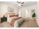 Inviting bedroom with a cozy bed, neutral decor, and a plant adding a touch of nature at 175 Orchard Ln, Covington, GA 30014