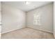 Bright bedroom with neutral paint, carpet, and a window allowing natural light at 175 Orchard Ln, Covington, GA 30014