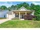 Charming single-story home with a well-manicured lawn and inviting front porch at 175 Orchard Ln, Covington, GA 30014