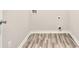 Practical laundry room with wood-look floors and white trim at 175 Orchard Ln, Covington, GA 30014