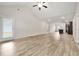Spacious living room features an open concept design with luxury vinyl plank flooring and natural light at 175 Orchard Ln, Covington, GA 30014