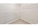 Walk-in closet with white wire shelving units at 175 Orchard Ln, Covington, GA 30014