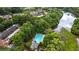 Aerial view showcasing the pool, community buildings, and a lake at 451 Tioram Se Ln, Smyrna, GA 30082